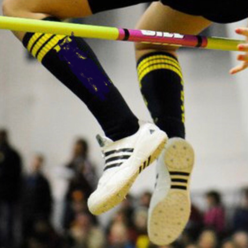 White and black high jump spikes